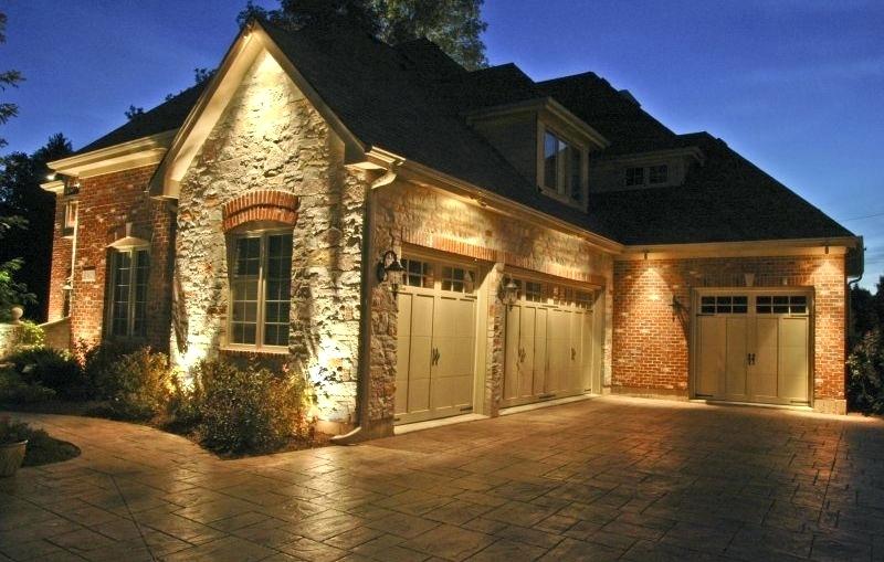 Beautiful home with landscape lighting at night
